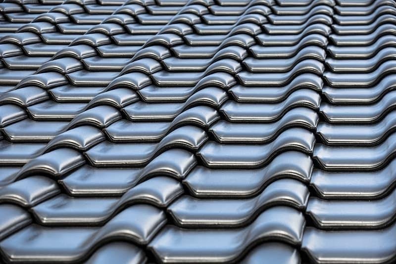 How Do Metal Roof Tile Designs Compare To Composite Roof Tiles?