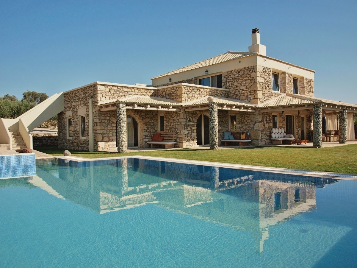 Contemporary Mediterranean Home with Flat and Hip Rooflines